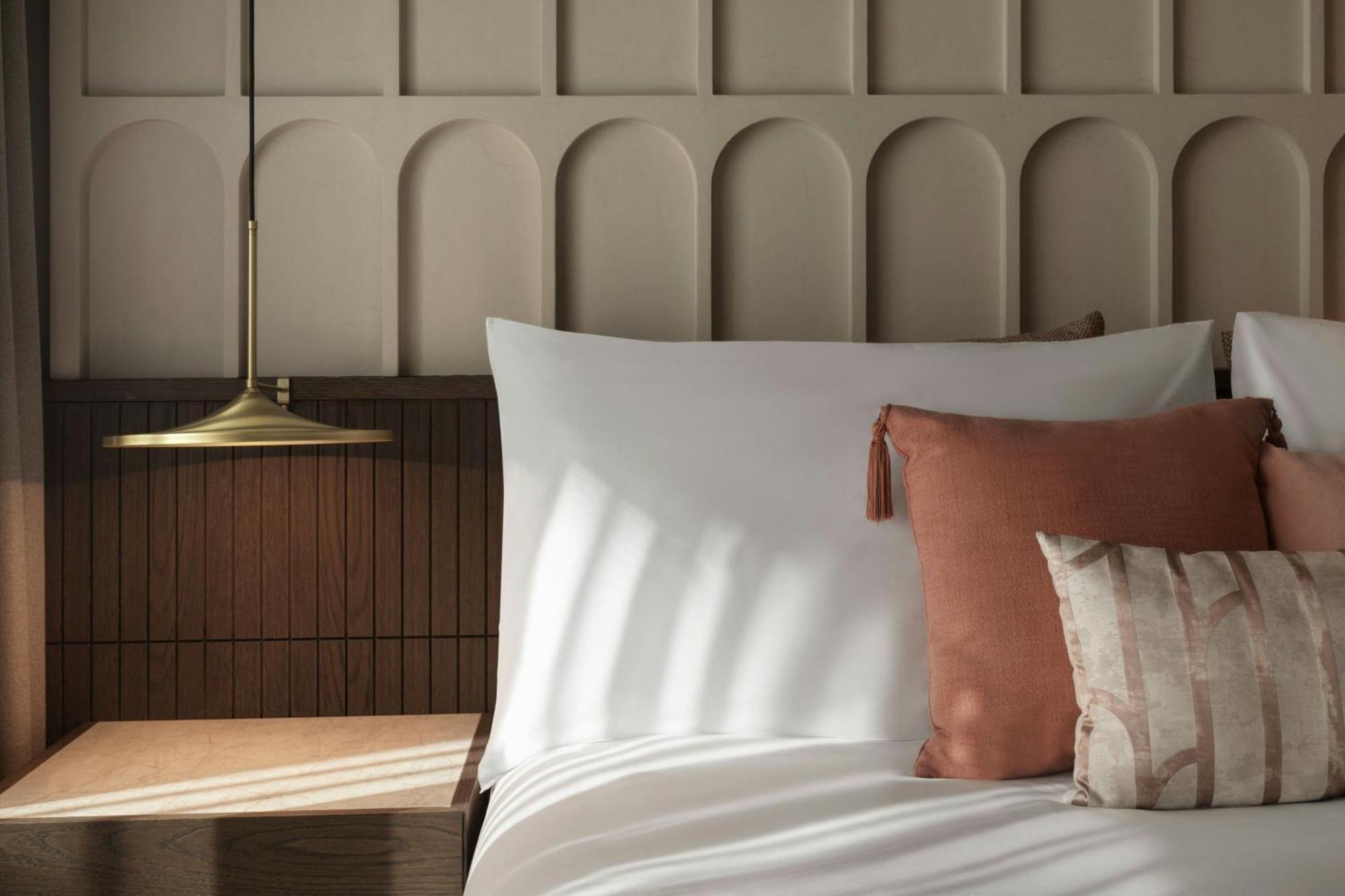 Отель Monasty, Thessaloniki, Autograph Collection Экстерьер фото A bed with a nightstand